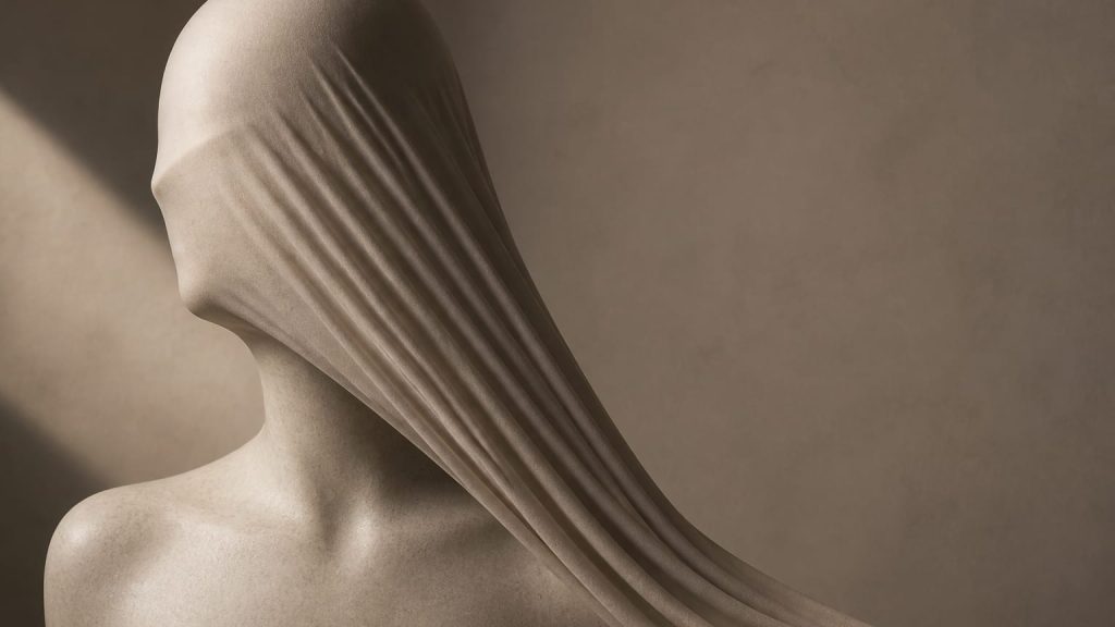 Soft sculptural fabric draping downward over a curved form with gentle shadows.