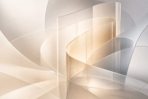 Abstract layered translucent forms intersecting over a soft neutral background.
